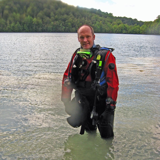 Mark Teece diver standing in water